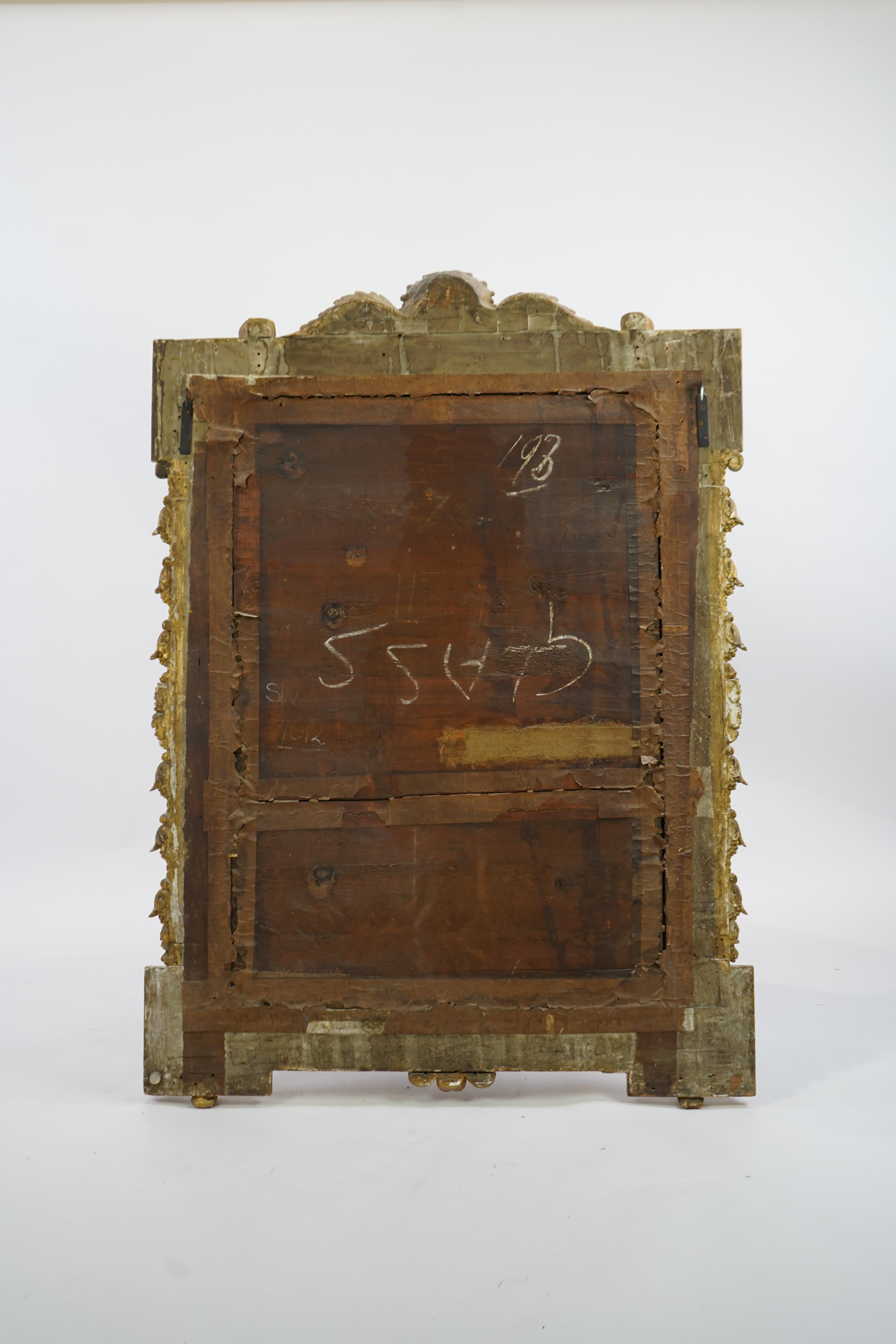 A late 19th century French carved gilt wood and composition overmantel mirror